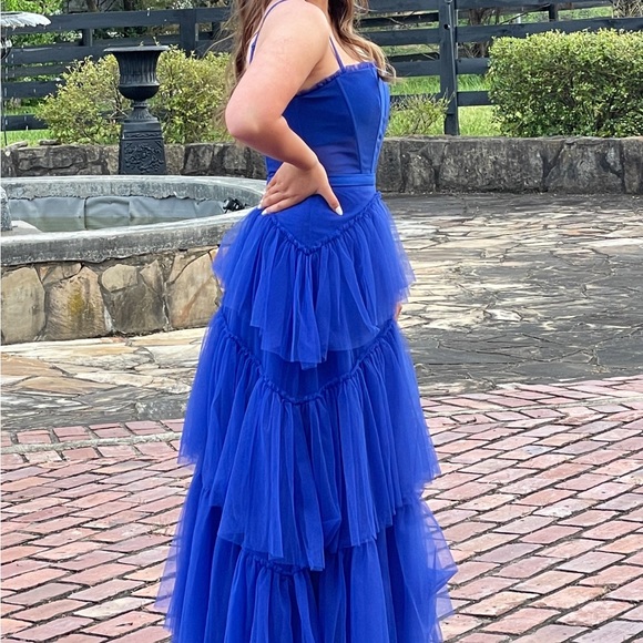 It is made of a mesh material, it is see through on the stomach only, blue dress - Picture 4 of 10